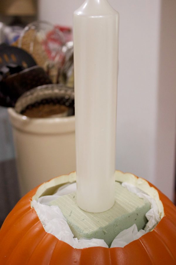 adding-the-candle-to-pumpkin-candleholder-planter | The Everyday Home | www.everydayhomeblog.com